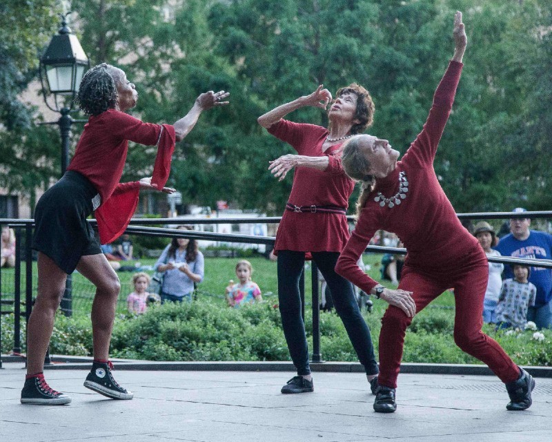 Elderly women dancing in the park