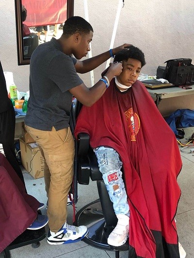 Picture of boy getting his hair cut