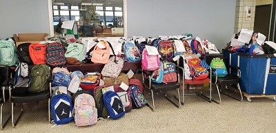 Picture of the hundreds of backpacks donated