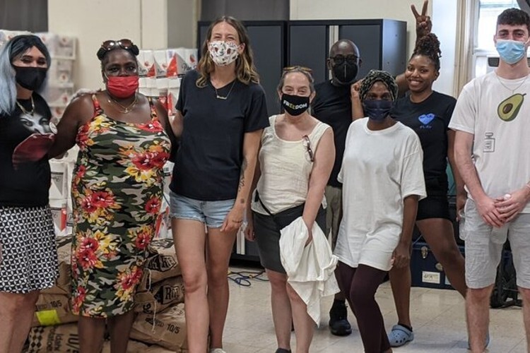 WANA Community Resource Center Group Photo - diverse group of people in masks